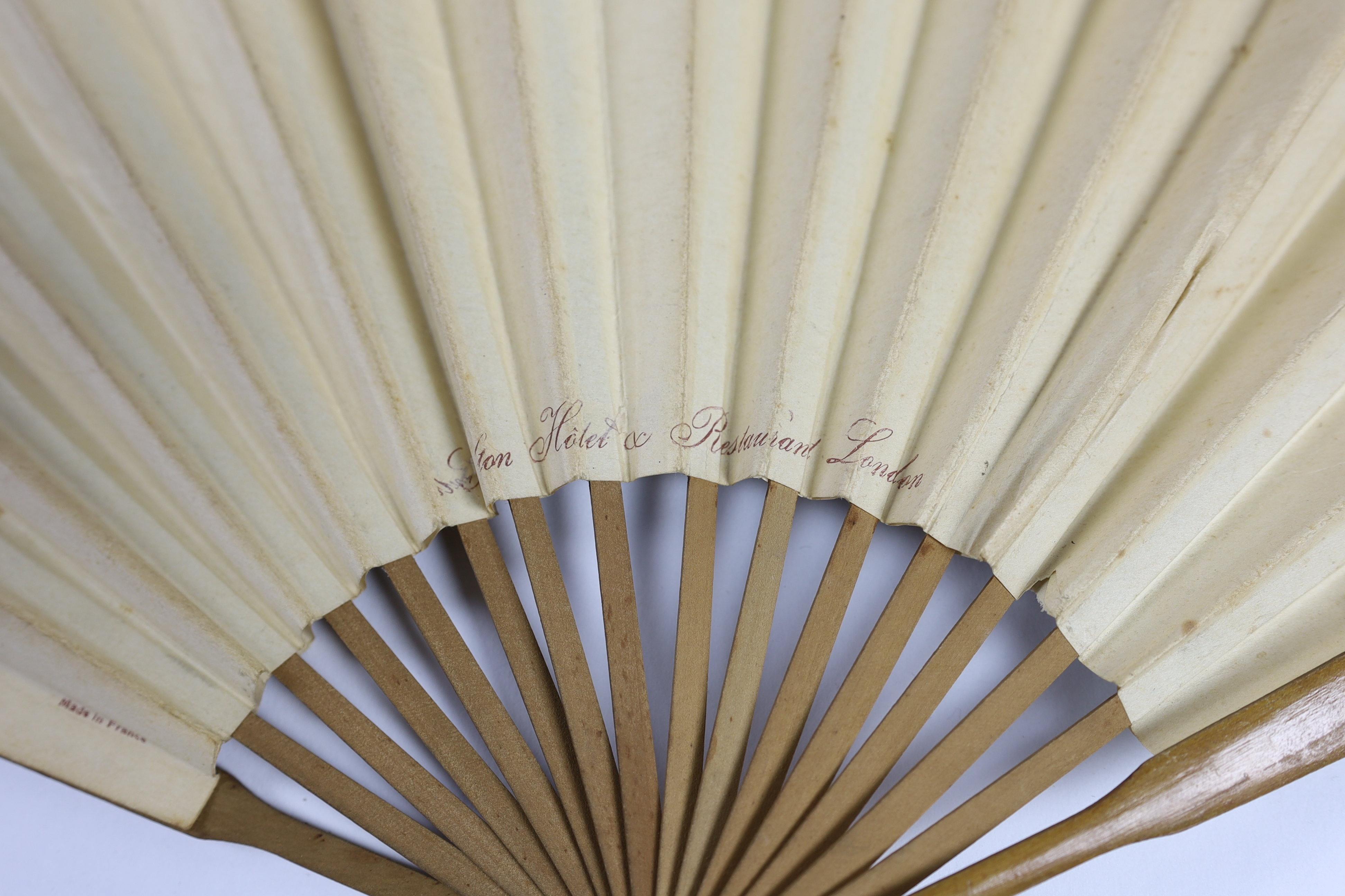 An unusual late 19th / early 20th century paper advertising fan for The Carlton Hotel, London (as printed on the back of fan leaf), signed on the front Georges Reson